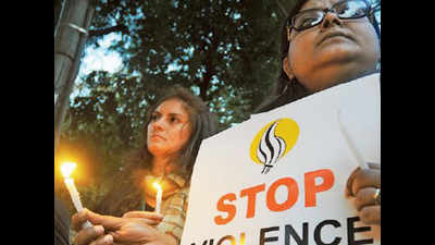 Activists hold candlelight vigil