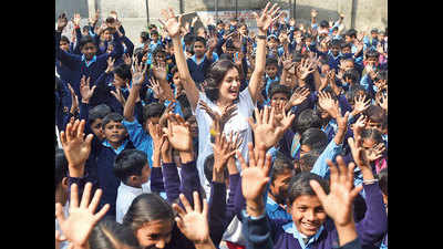 Dia Mirza gets hygiene lessons, plays saanp-seedhi at a Delhi school