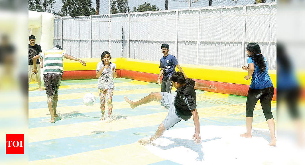 brazilian girls playing wet slip and slide soccer