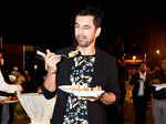 Anuj Sachdeva tasting delicacies at Times food awards