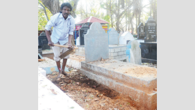 Granite, concrete tombs on graves continue to come up despite ban
