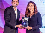 Rekha Chaudhari receives the Wellness Entrepreneur award from Abhay Deol
