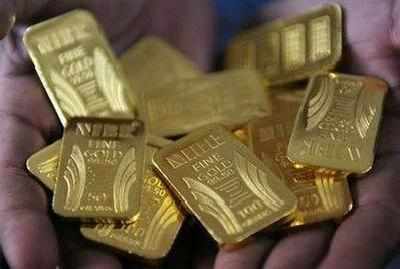 Gold climbs Rs 100 after dollar trips,silver retakes Rs 42,000