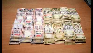 Rs 42 lakh in old notes seized from 2 in Surat