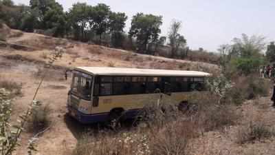 Bus goes off road as driver dies at the wheel