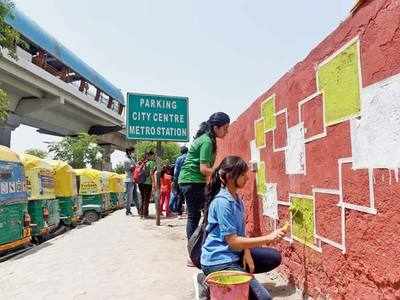 Once a dumping ground, Noida City Centre Metro Station wall gets a swachh makeover