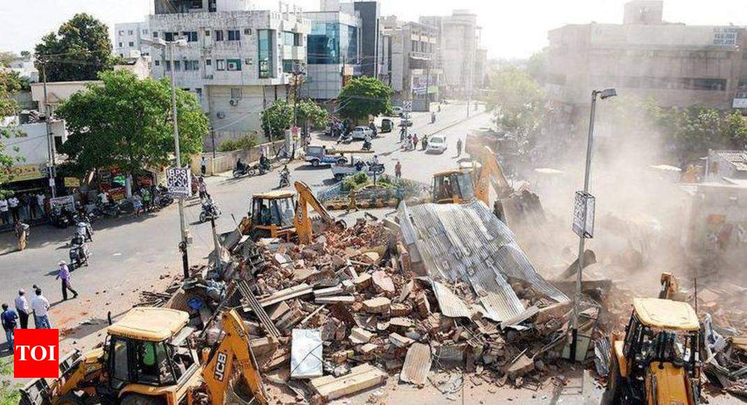 Dwellings razed around two ponds | Vadodara News - Times of India