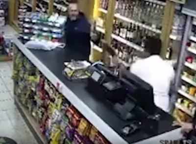 Indian shopkeeper fights off robber using vodka bottle, chair