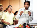 Kapil Mishra shows cheques