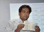 Kapil Mishra shows cheques