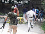 Policemen chasing SP College protestors