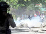 Policemen fire tear gas at the students