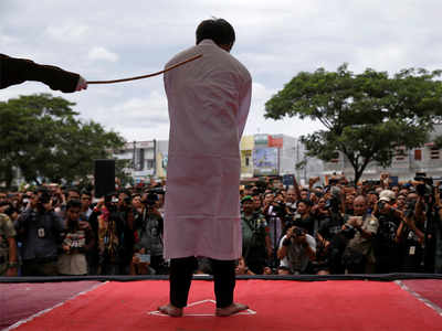Indonesian men caned for gay sex before jeering crowd in Aceh