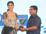 Actress Pooja Hegde giving award