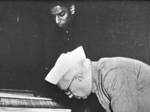 Jawaharlal Nehru signing a copy