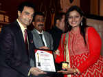 Dheeraj Kumar and Abhishek Bachchan presenting award to Sonal Sonkavde