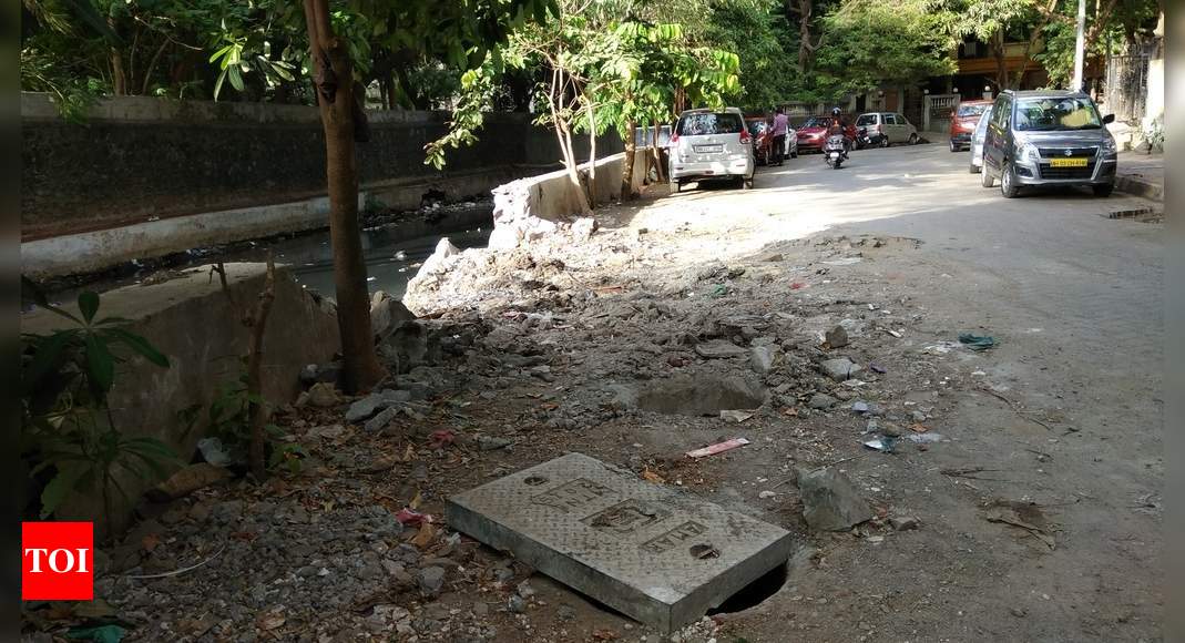 broken nallah wall and Manholes not repaired - Times of India