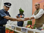 Rajnath Singh being presented a plant