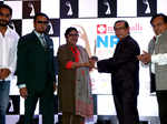 Gulshan Grover, Baldev Sharma and Rakesh Bedi presenting award