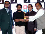 Gulshan Grover, Baldev Sharma and Rakesh Bedi presenting award to Rajesh Sharma