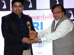 Sanjeev Gupta receiving award from Rakesh Bedi