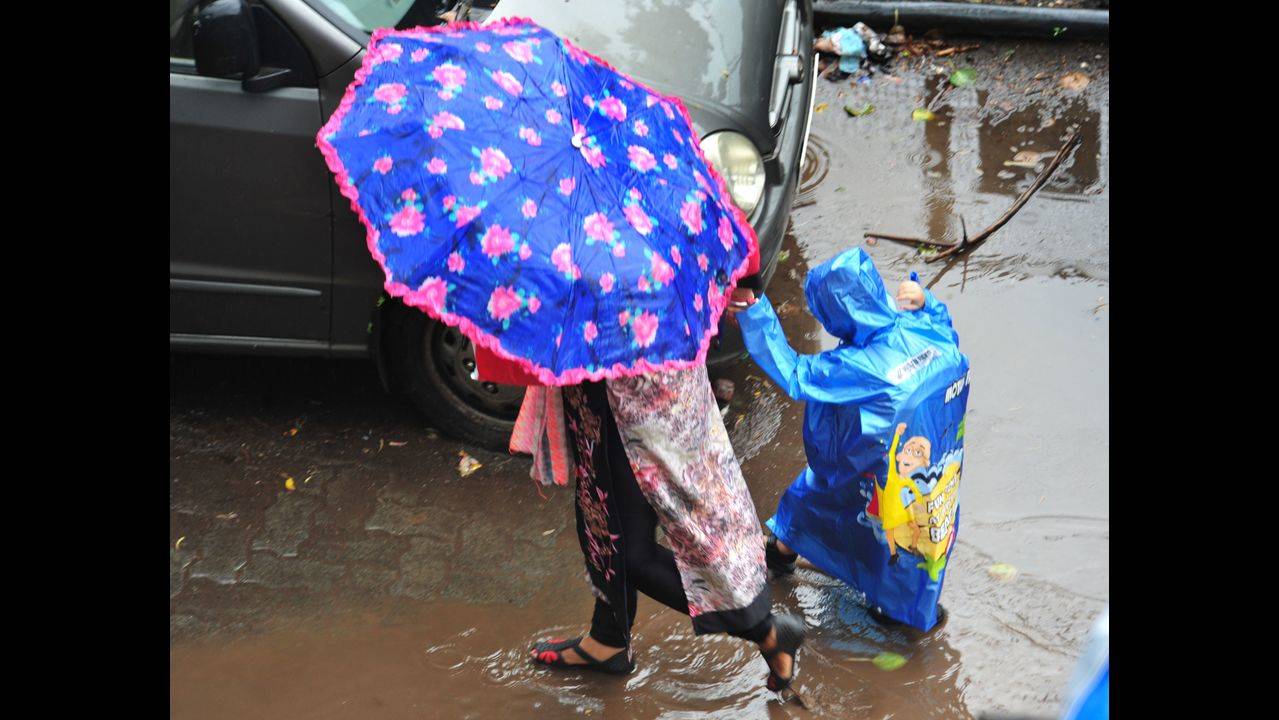 Rainy Season: With rainy season around, raincoat, umbrella sales up