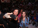 Tiger Shroff and Nidhhi Agerwal taking selfie with audience