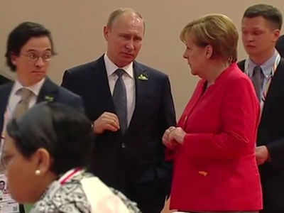 Angela Merkel 'eye-rolling' at Vladimir Putin during G20 summit takes social media by storm