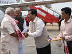 Narendra Modi being received by the Chief Minister of Assam Sarbananda Sonowal