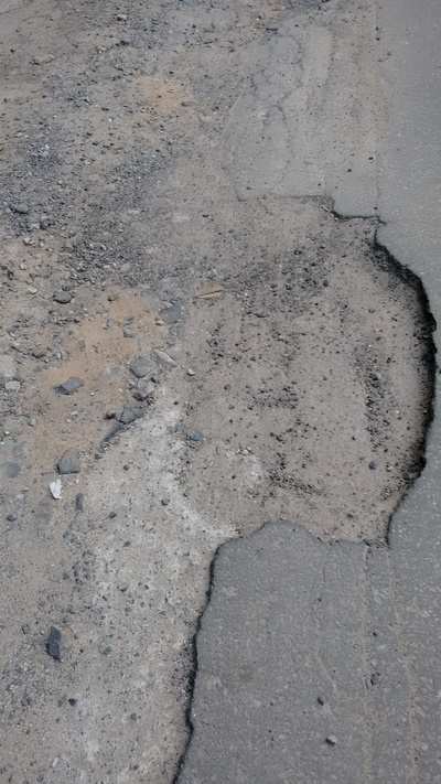 Broken road in Sidharth Extension - Times of India