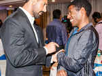 John Abraham exchanges notes with Olympic champion Haile Gebrselassie