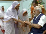 Widows of Vrindavan tying a rakhi