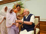 A widow of Vrindavan tying rakhi on the wrist of Prime Minister Narendra Modi