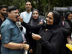 A Muslim woman offering sweets