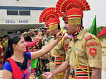 Women offering sweets to BSF personnel