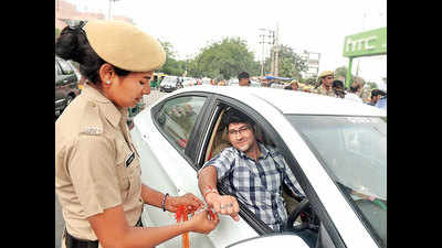 Spreading awareness through 'behengiri': Gurgaon's lady cops tie rakhis to traffic violators