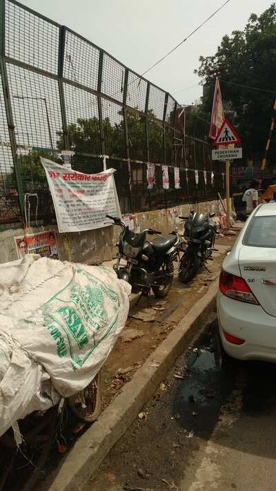 Footpath encroached - Times of India