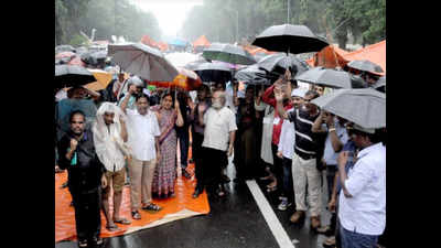 Agitating teachers brave heavy rain and thundershowers in Bhubaneswar