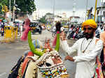 A man is seen with his decorated bullock