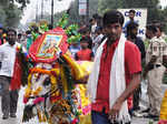 A man taking his decorated bullock