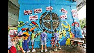 Students, artists remove DUSU election posters from graffitied wall at Moolchand