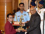 Ram Nath Kovind presents the Arjuna Award to pugilist Debendro Singh