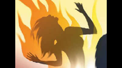 Woman sets herself and two kids ablaze