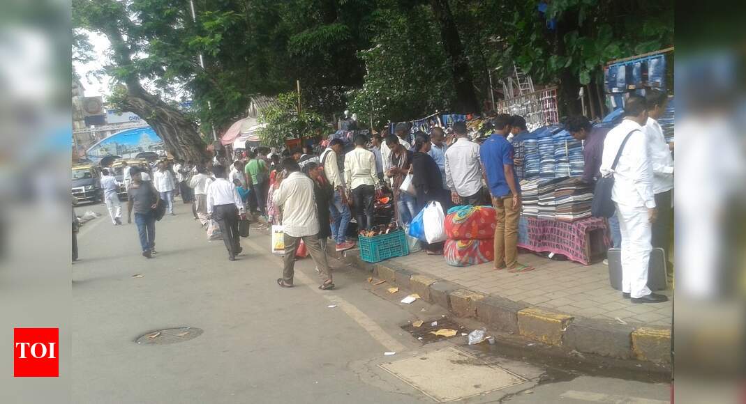 Hawkers encroach on footpath - Times of India