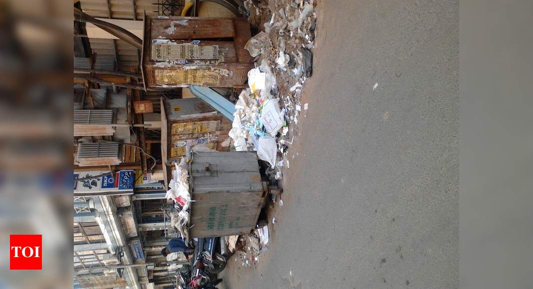 Garbages strewn on the road... - Times of India