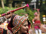 A folk dancer in a traditional attire rehearse Garba