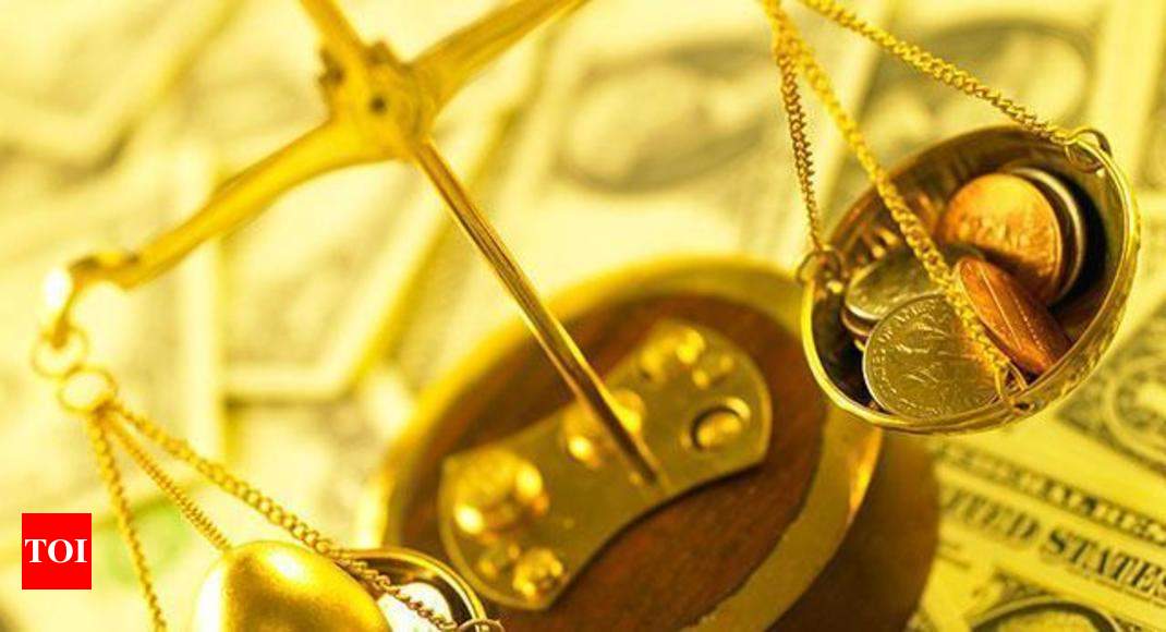 How much one ounce gold weights? - Times of India