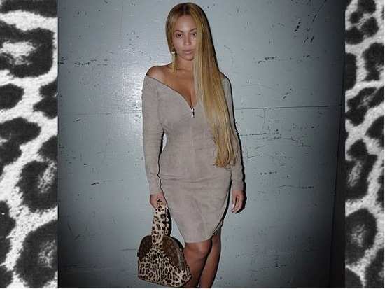 Whoa! Beyonce puts her curves on display in this clingy taupe mini dress
