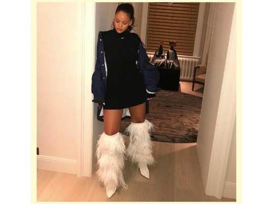 Rihanna works a pair of boots like you’ve never seen before. Trust us!