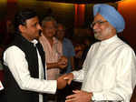 Akhilesh Yadav shakes hand with Manmohan Singh